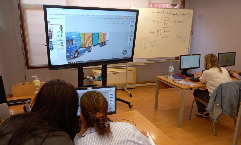 Three KAEME students in Spain using EasyCargo and a&nbsp;classroom projector for practical load planning.